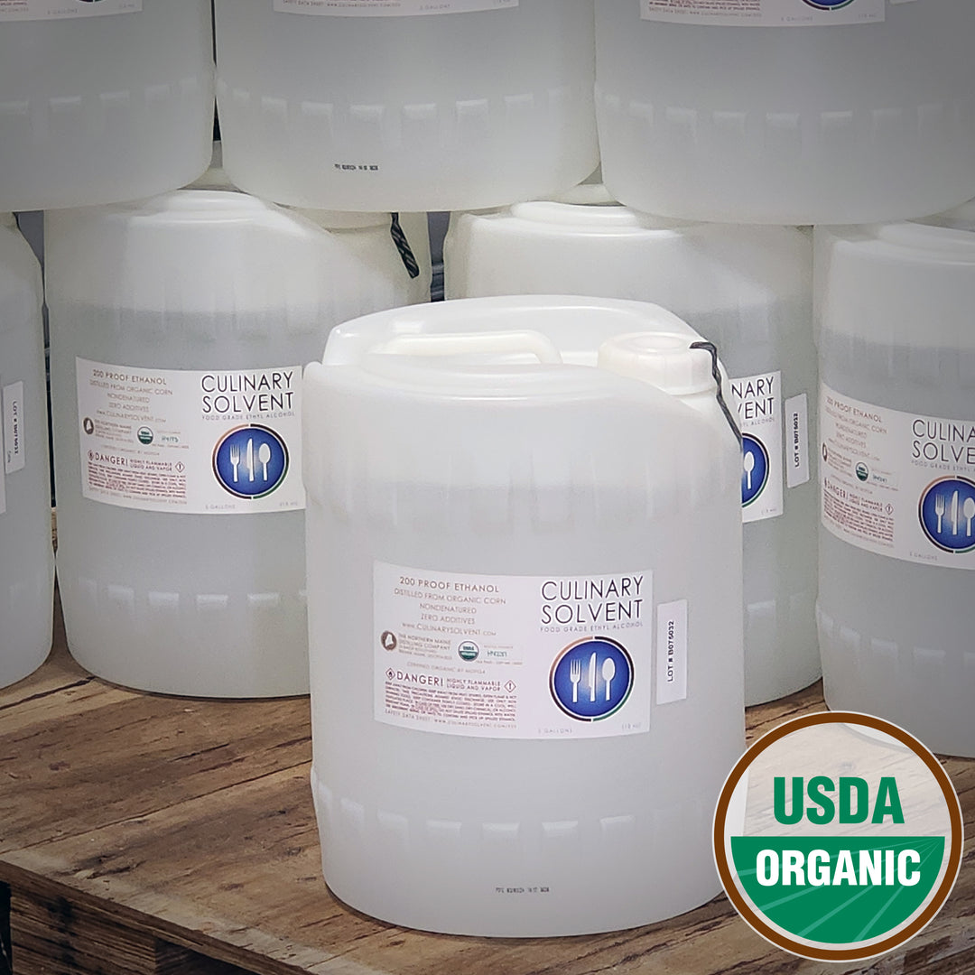 Pure Organic 200 proof food grade ethanol bulk in 5 gallon jugs pails on a pallet with USDA Organic Logo