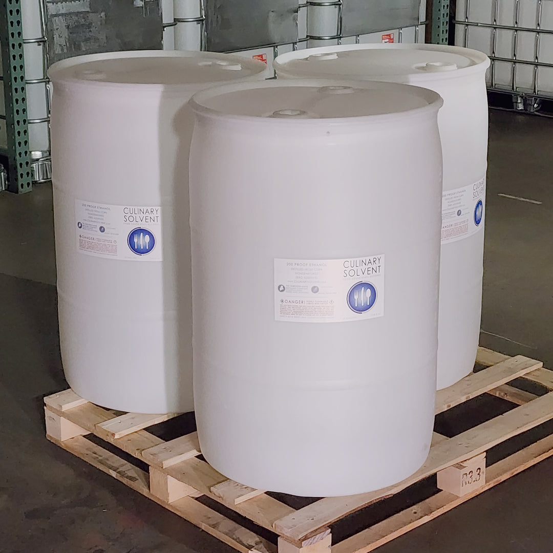 Pure 200 Proof Food Grade Ethanol 55 gallon drums by Culinary Solvent for extracts, perfuming, and more on a pallet in distillery shipping area